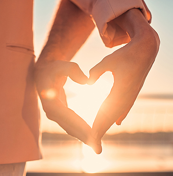 Love is in the air! Cute romantic couple spending time together in the city. Handsome bearded man and attractive young woman are in love. Hugging, kissing and having fun during the sunset.