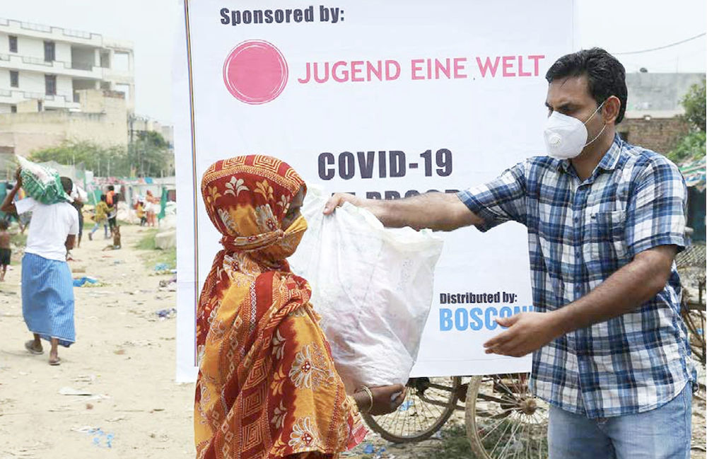Lebensmittelverteilung in Indien / Jugend Eine Welt / DB Network Asia